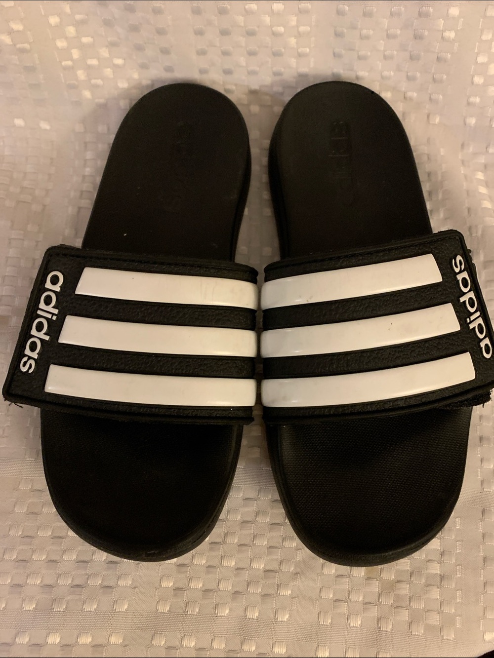 Adidas kid’s black slide sandals with Adidas classic three white stripes, size 3